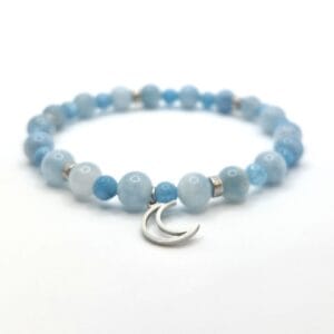 damska bransoletka z akwamarynek, srebrnymi przekładkami i zawieszką księżyc