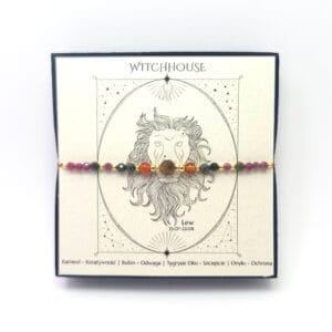 Bransoletka dla Lwa z karneolem i rubinem, wykonana ze stali chirurgicznej w kolorze złotym.