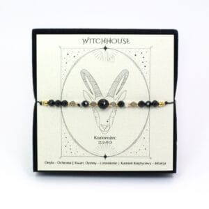 Bransoletka intencyjna dla Koziorożca z kamieniami czarny onyks i kwarc dymny na sznurku, wykończona stalą chirurgiczną w kolorze złotym.